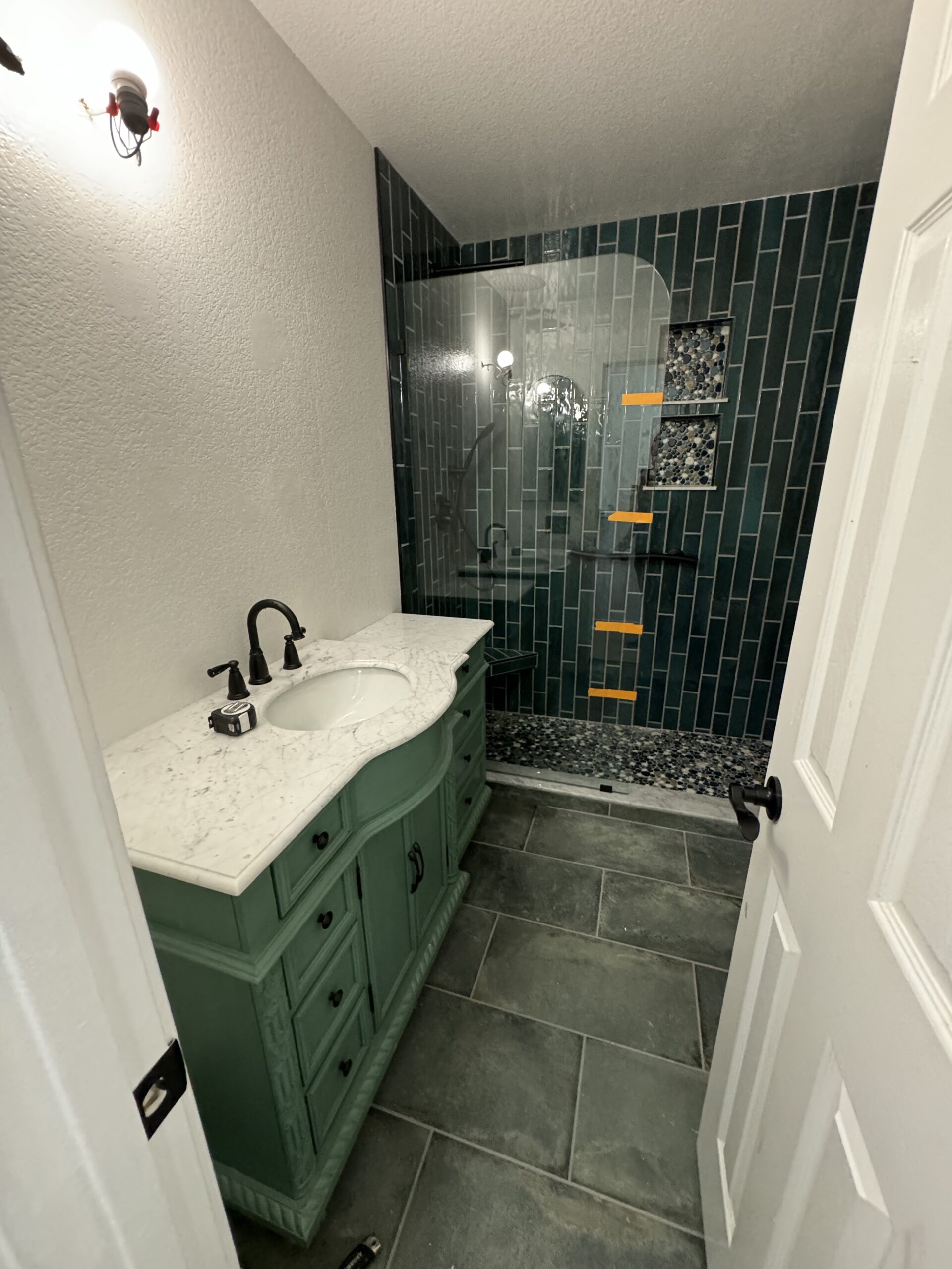 Newly renovated bathroom with modern vanity, stylish fixtures, and enhanced storage, completed by Papa's Home Improvements